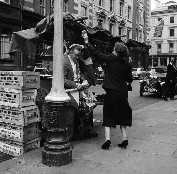 A decorated barrow boys stall on the eve of his wedding, outside Charing Cross Station