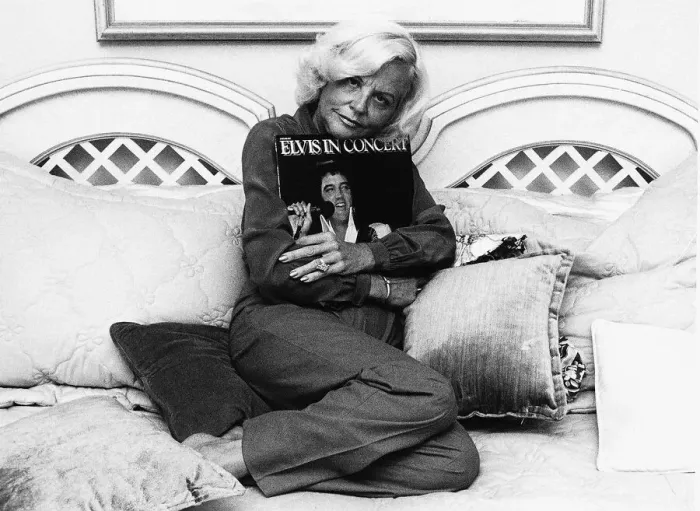 Framed Print : Dee Presley Elvis Presley step mother Dee Presley hugs the memorial album set of Elvis