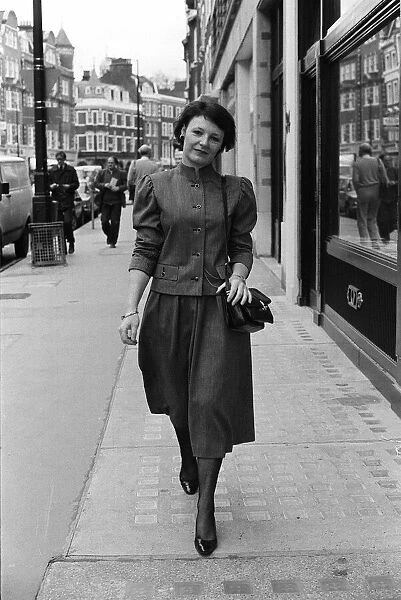 Delia Smith tv cookery expert walking down the street