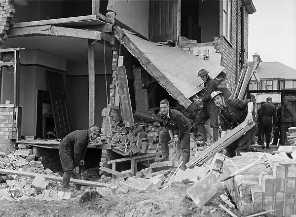 A demolition squad make safe a bomb damaged building at Hodge Hill Common following a