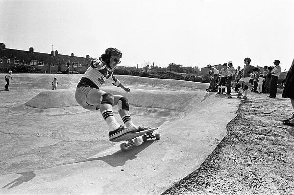 Demonstration of skateboarding skills in the bowl at the Cambridge Skatepark