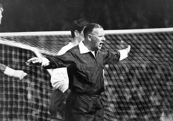 Denis Howell, Minister of Sport, referees the match. August 1965