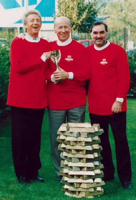 Framed Print : Denis Law with Bobby Charlton and George Best hold 1966 World Cup replica Framed Print : Denis Law with Bobby Charlton and George Best hold 1966 World Cup replica