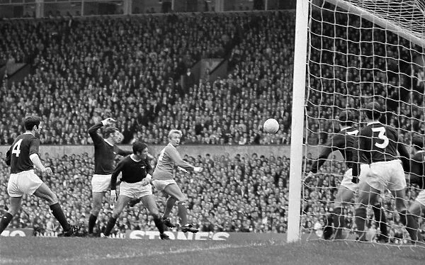 Six to one against but Denis Law still connects with a cross during Manchester United