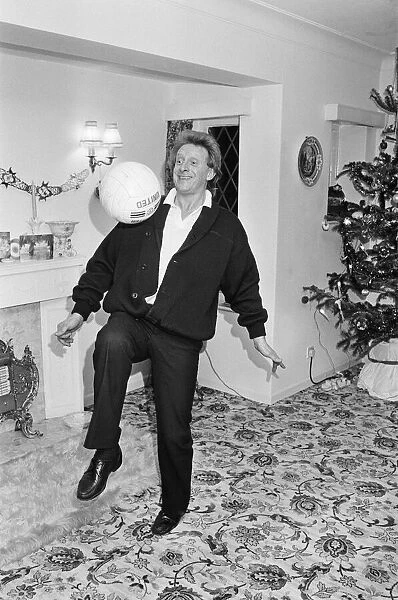 Denis Law, at home over Christmas in 1987. Denis Law CBE