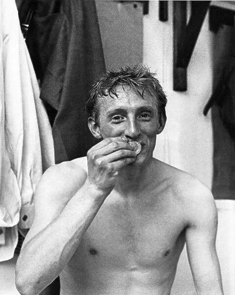 Denis Law kisses his FA Cup winners medal after his team Manchester United beat Leicester