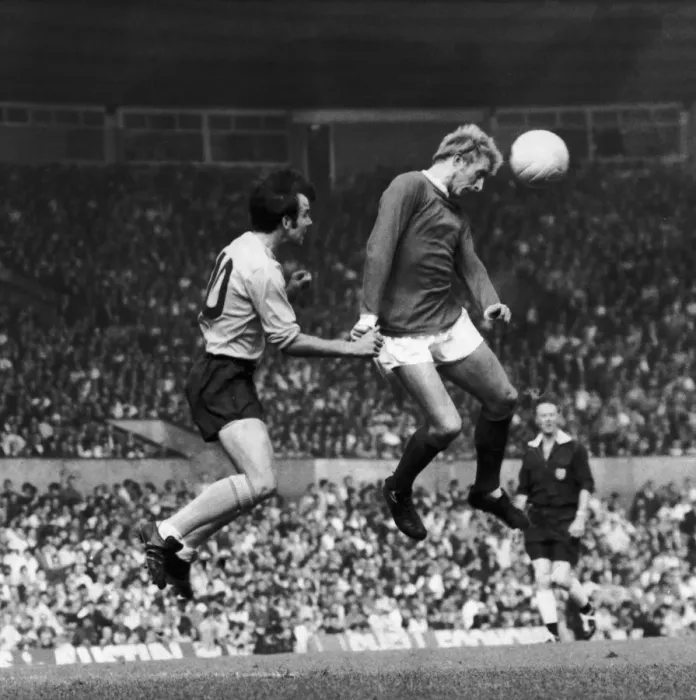Framed Print : Denis Law of Manchester United beats Southamptons Tony Byrne during this heading Framed Print : Denis Law of Manchester United beats Southamptons Tony Byrne during this heading