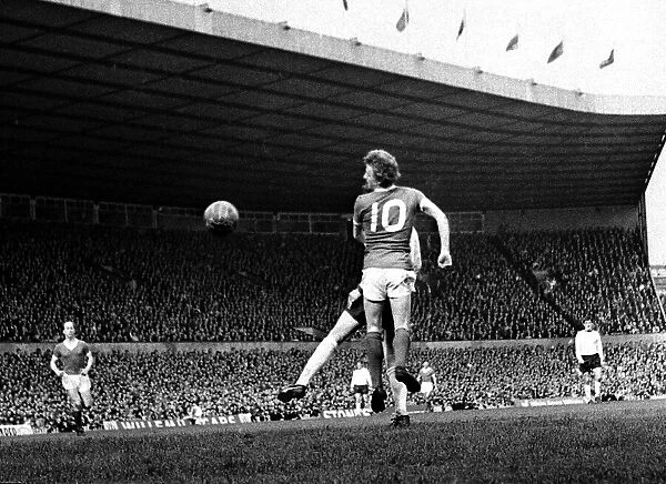 Denis Law of Manchester United jumping up for the hogh ball during his side
