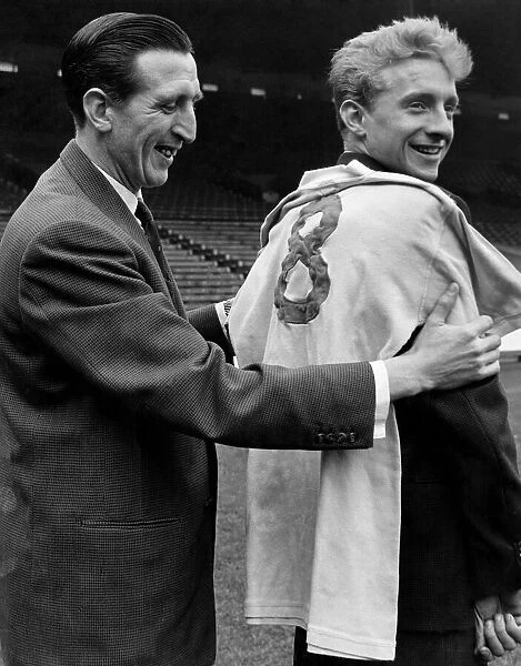 Denis Law meets his new jersey and the Capt of Manchester City team Ken Barnes