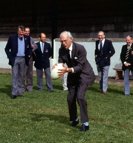 Denis Thatcher holding rugby ball September 1986