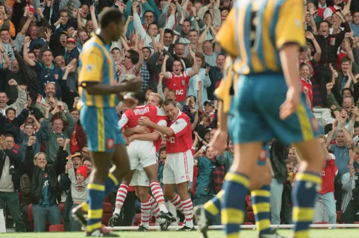 Framed Print : Dennis Bergkamp celebrates his first ever goal for his new club Arsenal