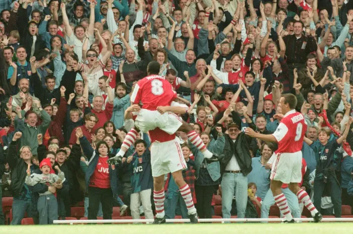 Framed Print : Dennis Bergkamp celebrates his first ever goal for his new club Arsenal