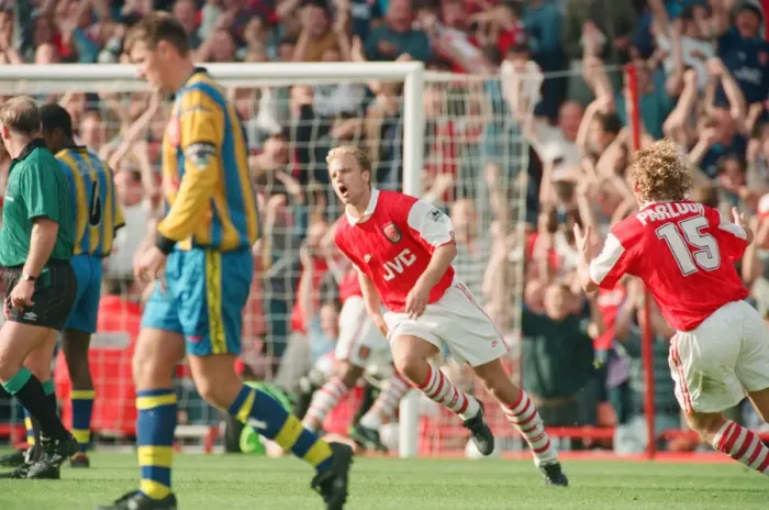 Framed Print : Dennis Bergkamp celebrates his second goal for his new club Arsenal