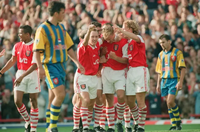 Framed Print : Dennis Bergkamp celebrates his second goal for his new club Arsenal
