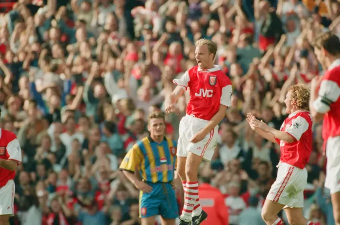 Framed Print : Dennis Bergkamp celebrates his second goal for his new club Arsenal
