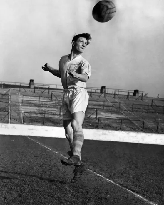 Framed Print : Dennis Fidler, the Manchester City outside left heading the ball during a training Framed Print : Dennis Fidler, the Manchester City outside left heading the ball during a training