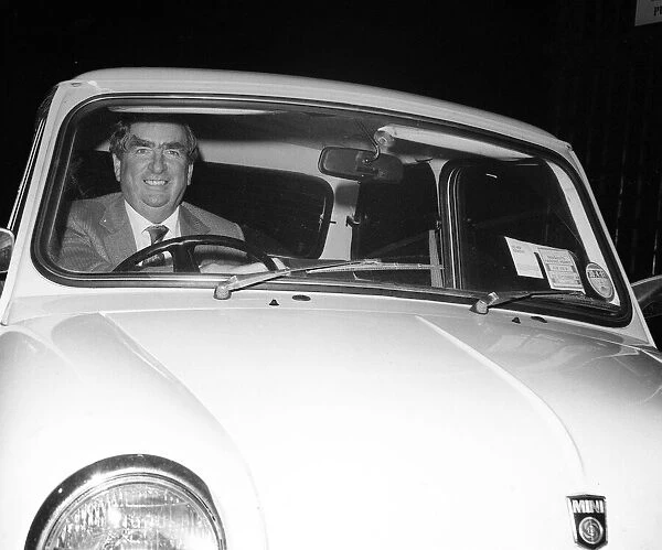 Dennis Healey MP driving in his Mini car October 1980