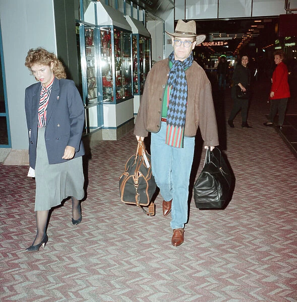 The departure of Elton John to New York. London Heathrow Airport. 28th November 1991