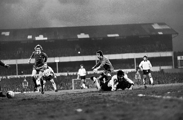 Derby County (2) v. Liverpool (0). Davies ends in mud after (above)