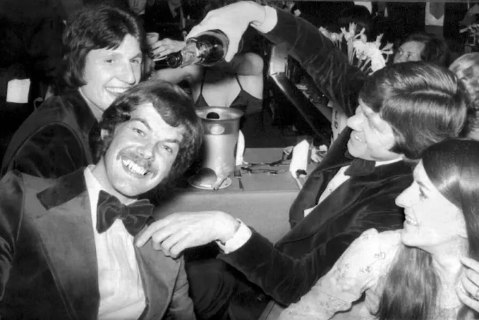 Framed Print : Derby County footballer Roger Davies looks on as David Nish pours champagne over Peter Framed Print : Derby County footballer Roger Davies looks on as David Nish pours champagne over Peter