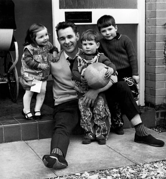 Derby County manager, Brian Clough, pictured at home with his children, Elizabeth