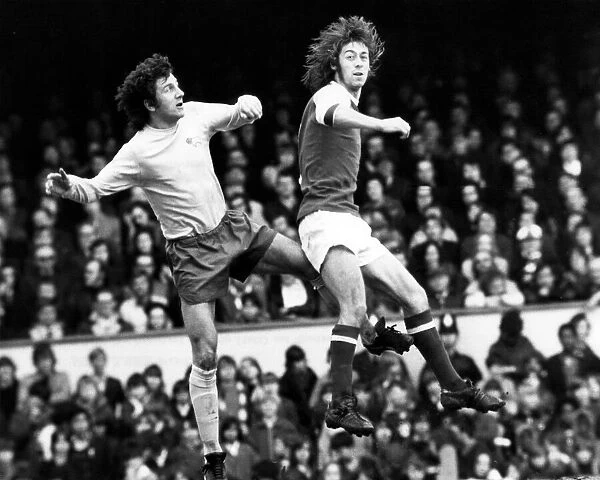 Derby Countys Roy McFarland leaps with Arsenal