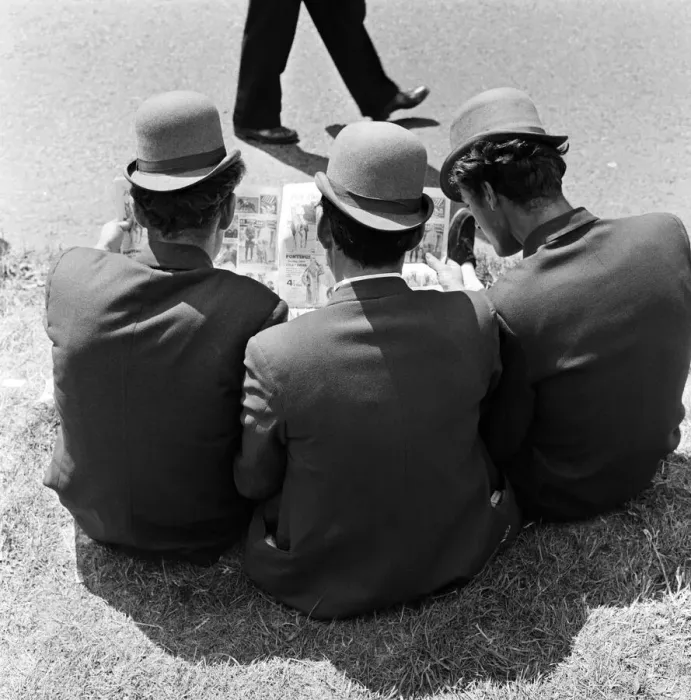 Framed Print : Derby Day at Epsom. Pictured, three lads from Newmarket sitting on the grass studying Framed Print : Derby Day at Epsom. Pictured, three lads from Newmarket sitting on the grass studying