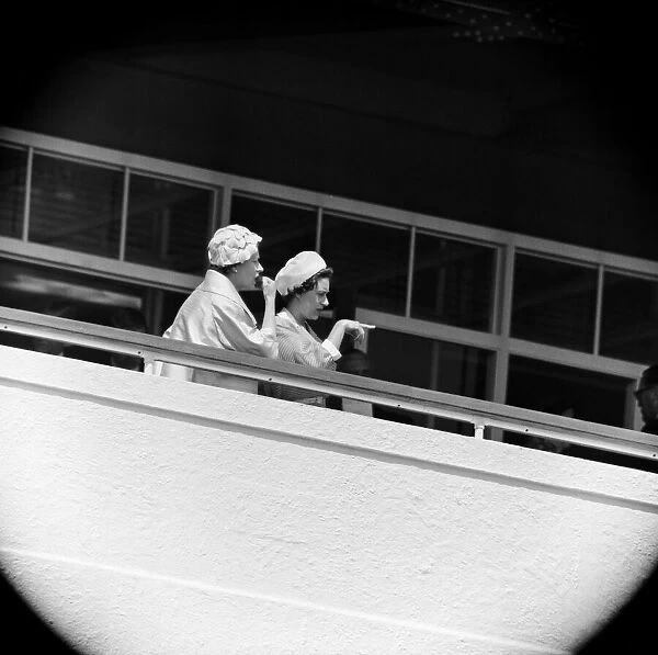 Derby Day at Epsom. Pictured, Queen Elizabeth II and Princess Margaret watching a race