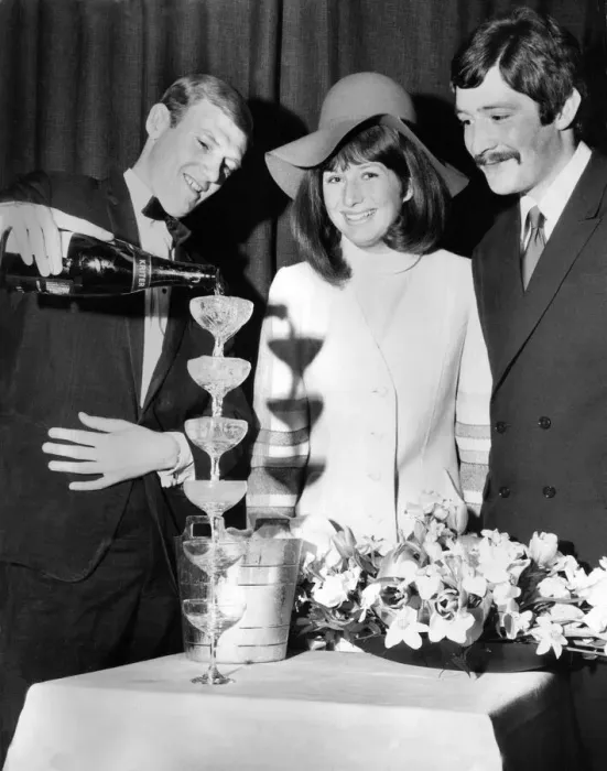 Framed Print : Derek Bower, wine waiter at the Moulin Rouge pours six champagne glasses at once