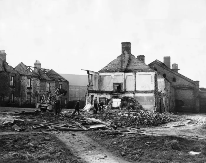 Framed Print : Derelict housing in an area of Stanley - workmen clear the site