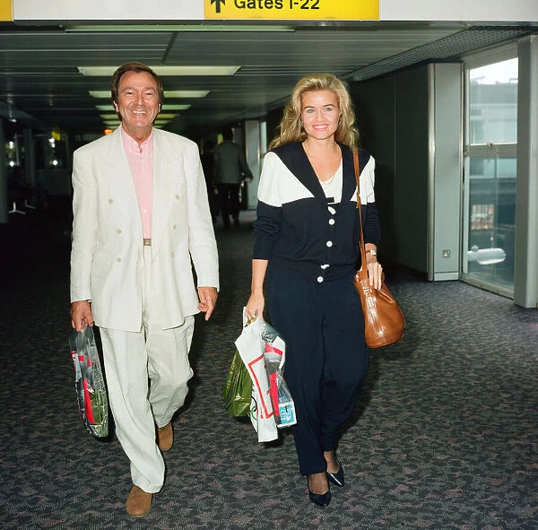 Des O Connor and girlfriend Jodie Brooke Wilson and Heathrow Airport