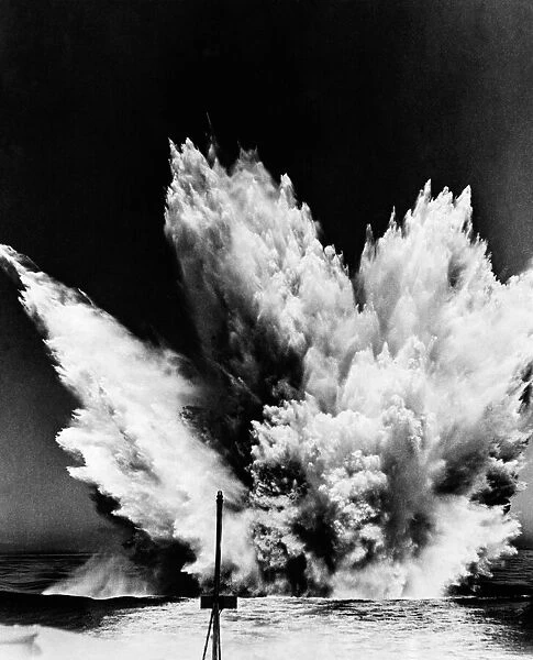 A US destroyer fires a pattern of depth charges during a search for a German U-boat