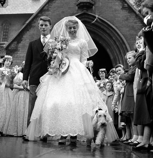 Diana Capel with her pet fox terrier Champ at her wedding at St Michaels Church in