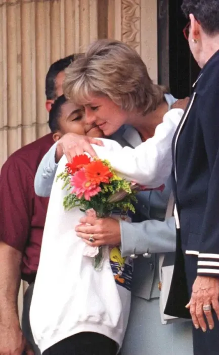 Framed Print : Diana, Princess of Wales, hugs a young girl who gave her flowers as she leaves Cook Framed Print : Diana, Princess of Wales, hugs a young girl who gave her flowers as she leaves Cook