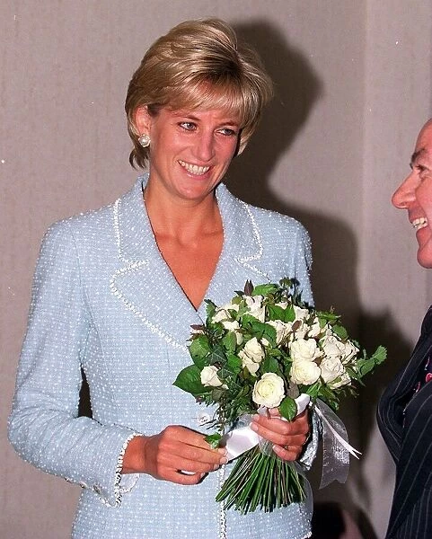 Diana, Princess of Wales is presented with the first rose to be named after her at