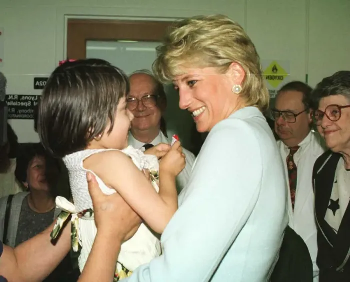 Framed Print : Diana, Princess of Wales, smiles as she holds a young girl at Cook County Hospital Framed Print : Diana, Princess of Wales, smiles as she holds a young girl at Cook County Hospital