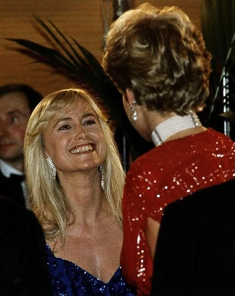 Diana, Princess of Wales talks to actress Susan George as she attends the premiere of