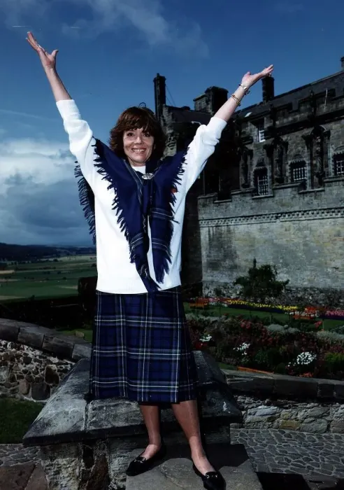 Framed Print : Diana Rigg actress Stirling Castle Scottish Rugby Union tartan skirt shawl arms raised Framed Print : Diana Rigg actress Stirling Castle Scottish Rugby Union tartan skirt shawl arms raised