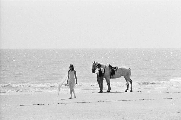 Diana Rigg, who plays Emma Peel, and her white horse on the beach at St Marys Bay