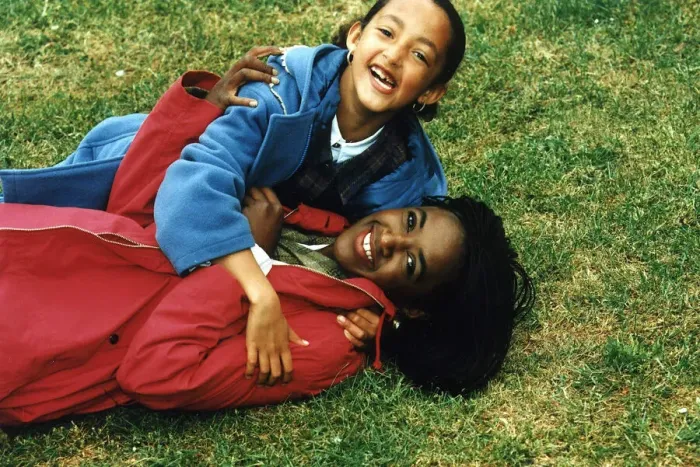 Framed Print : Diane Louise Jordan on grass with her niece Justine young girl in blue jacket Framed Print : Diane Louise Jordan on grass with her niece Justine young girl in blue jacket