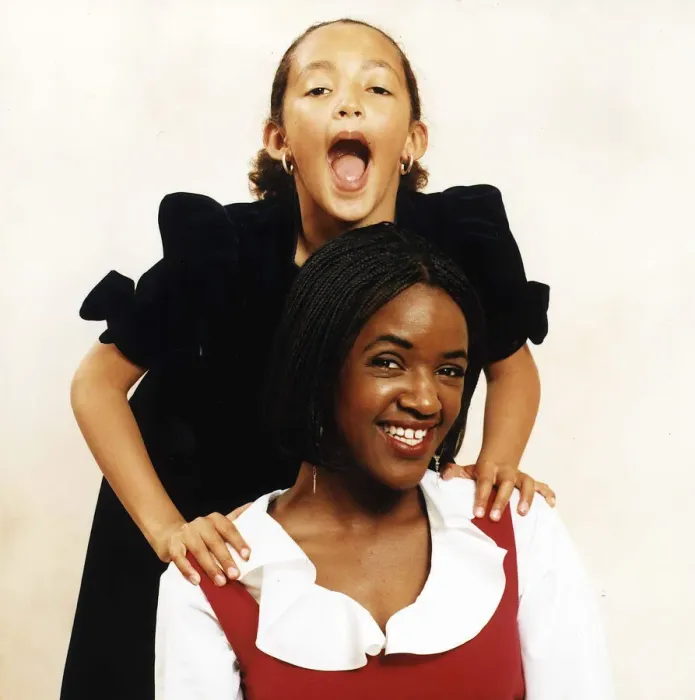 Framed Print : Diane Louise Jordan with young girl her niece Justine in black dress A©mirrorpix