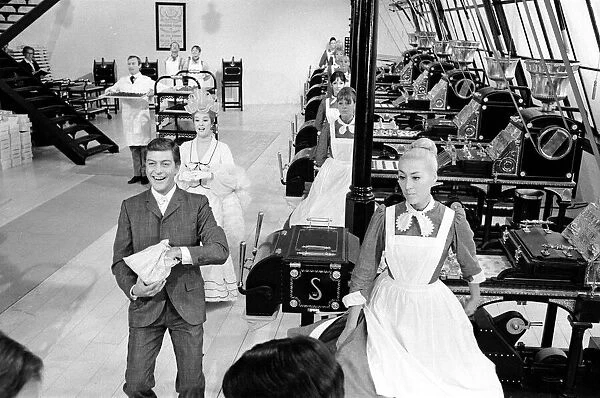 Dick Van Dyke and Sally Ann Howes (behind) filming a scene for Chitty Chitty Bang Bang