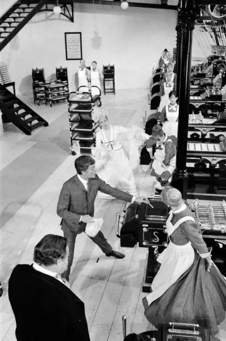 Framed Print : Dick Van Dyke and Sally Ann Howes (behind)) filming a scene for Chitty Chitty Bang Bang