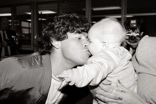 Diego Maradona - Football Player - August 1987 with Baby