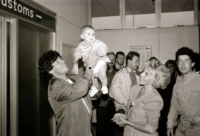 Framed Print : Diego Maradona - Football Player - August 1987 with Baby Framed Print : Diego Maradona - Football Player - August 1987 with Baby