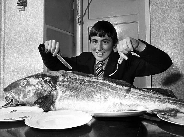Bill digs in to eat the 42lb cod he caught, off Largs, all by himself! May 1972