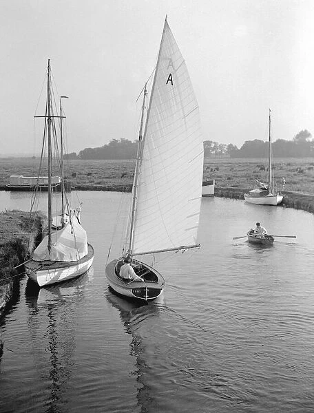 A dinghy sailing on the Norfolk Broads, circa 1936