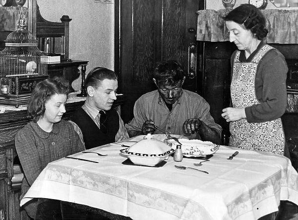 Dinner time for Pitman Tom, at home in Stanley. He is pictured with his wife and children