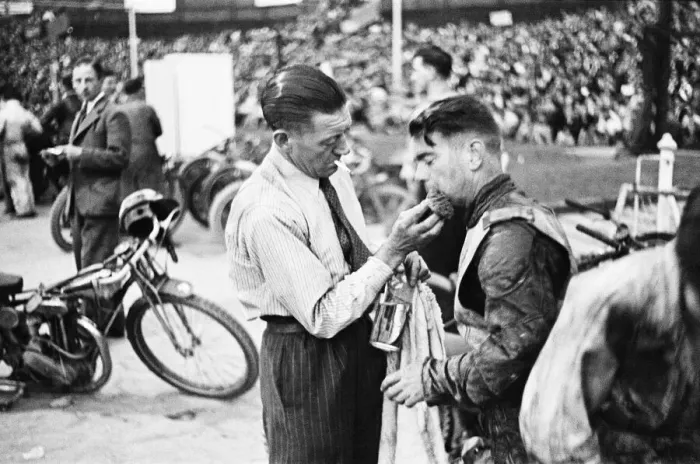 Framed Print : Dirt Track races in London. (Picture shows) A competitor receiving treatment for an Framed Print : Dirt Track races in London. (Picture shows) A competitor receiving treatment for an