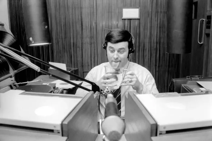 Framed Print : Disc Jockey Terry Wogan enjoys a large jug of water during broadcast of his afternoon Framed Print : Disc Jockey Terry Wogan enjoys a large jug of water during broadcast of his afternoon